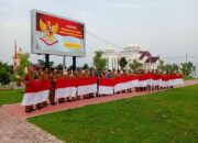 Pj Bupati Aceh Utara Serahkan 10 Juta Bendera Merah Putih